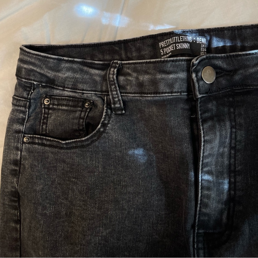 PrettyLittleThing black acid 5 pocket skinny jeans.